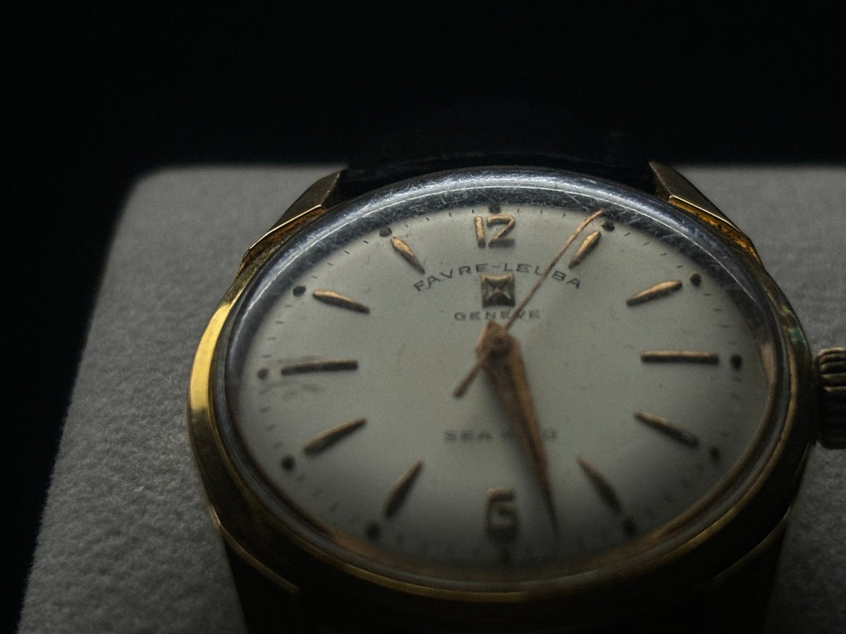 Dark studio close-up of the Favre-Leuba Genève Sea King silver dial and applied markers.