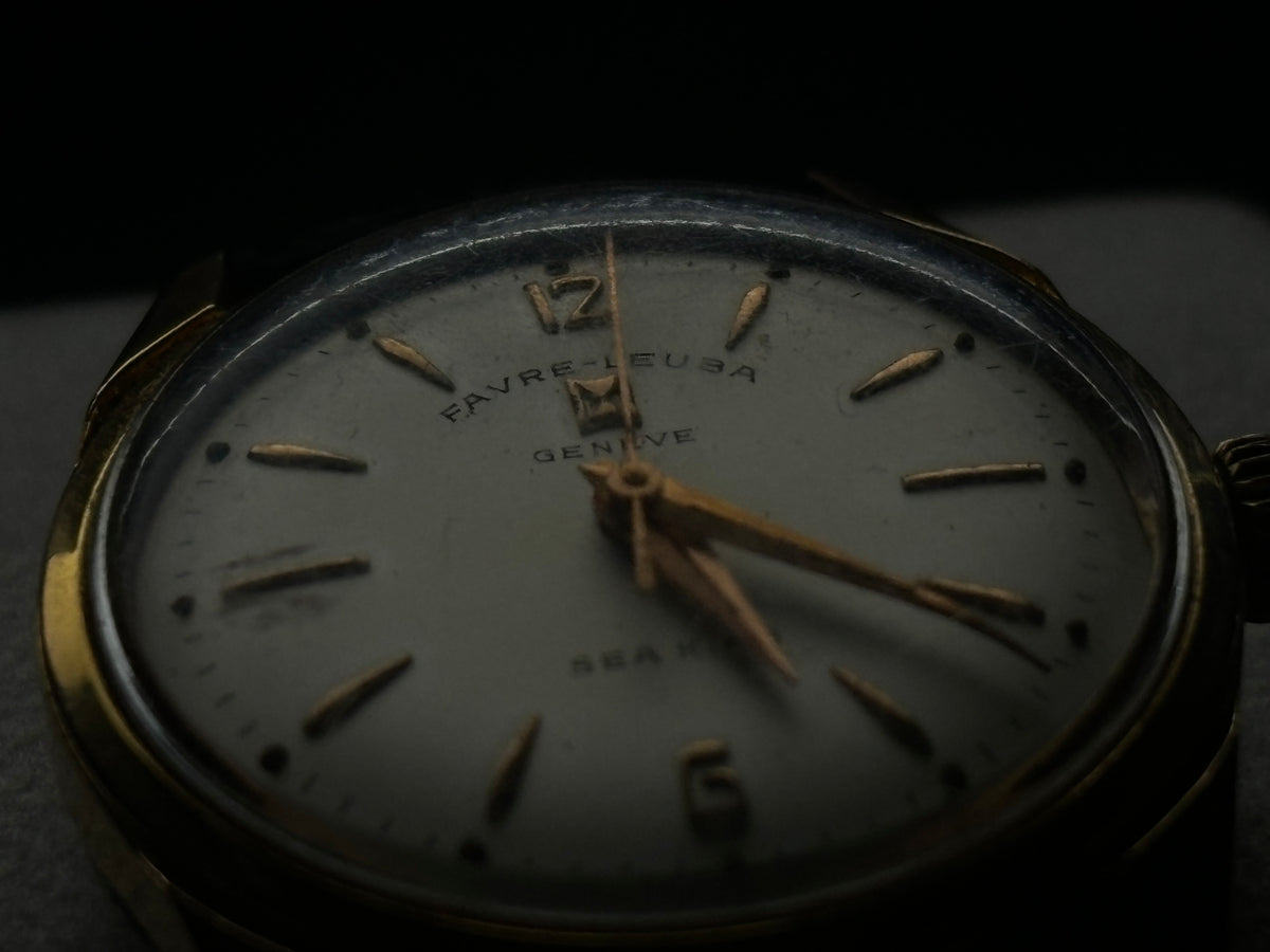Close-up studio view of the Favre-Leuba Genève Sea King dial with applied gold hour markers.