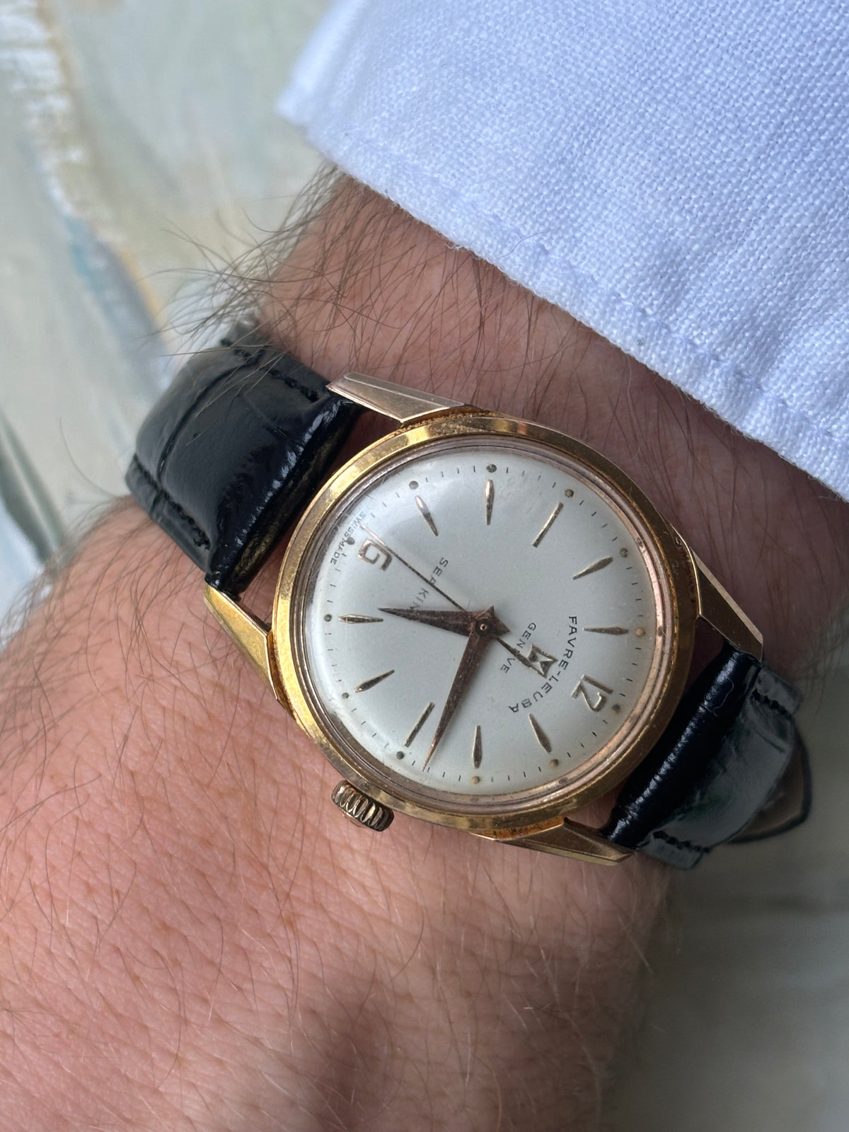 Side-profile wrist shot showing the slim gold-tone case of the Favre-Leuba Genève Sea King.