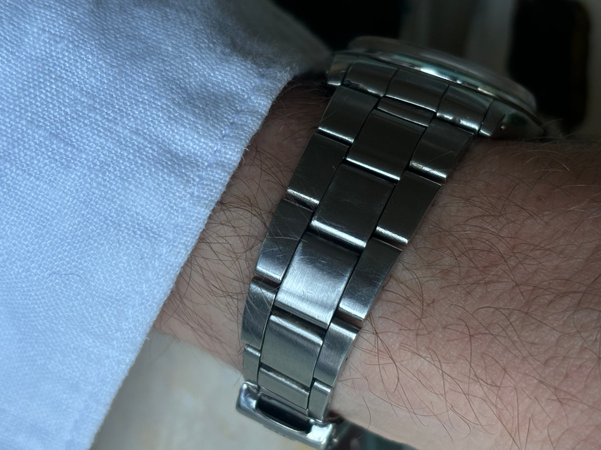 Stainless-steel Oyster bracelet of vintage Rolex Air-King-Date Precision ref. 5700 worn on wrist