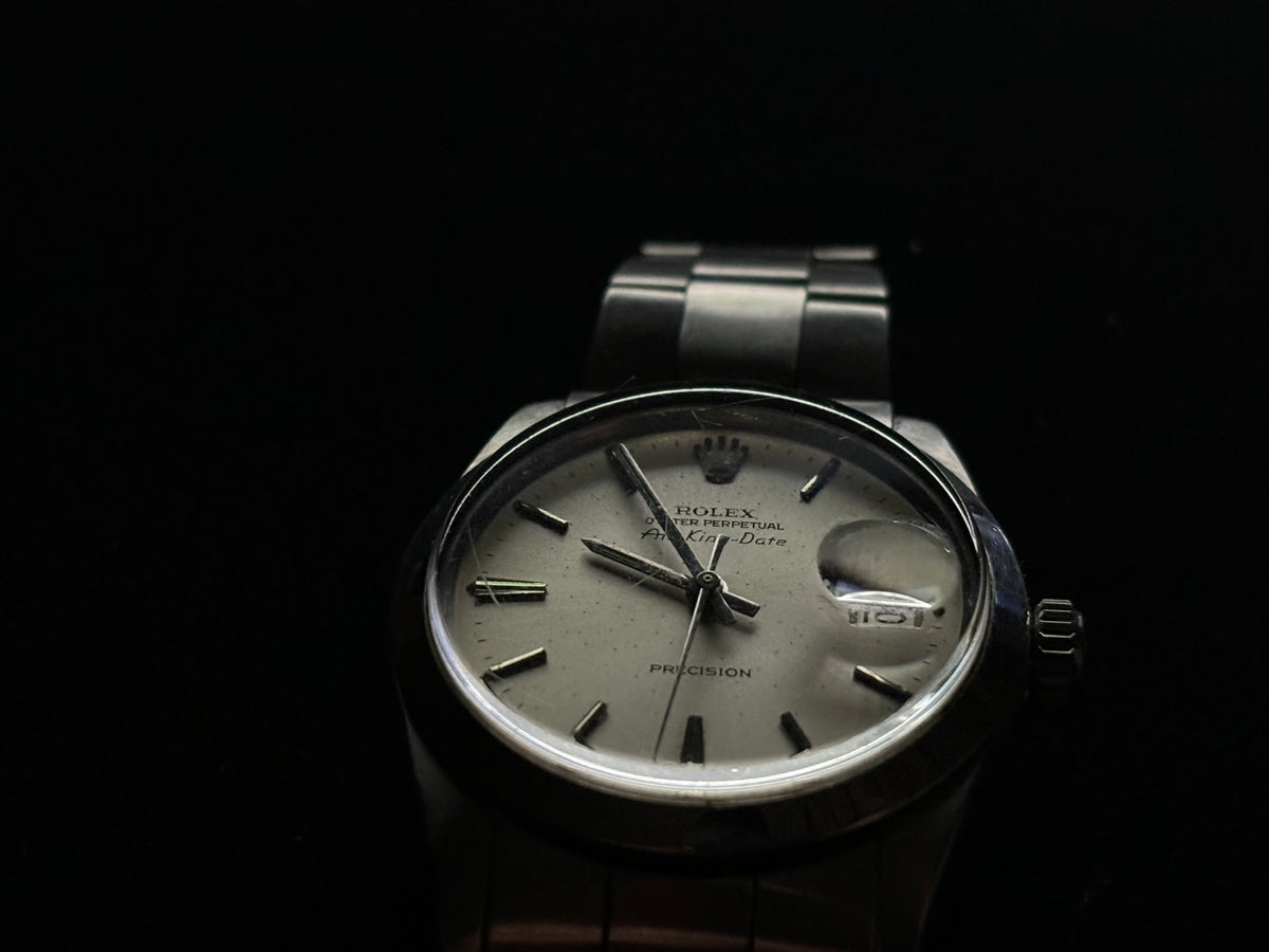 Full studio shot of vintage Rolex Air-King-Date Precision ref. 5700 with silver dial and Oyster bracelet