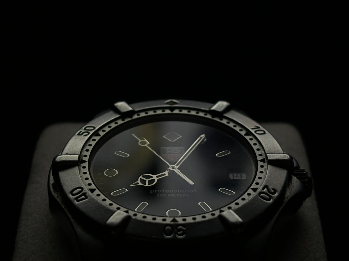 Low-angle studio view of a vintage TAG Heuer Professional 200 Metres watch.